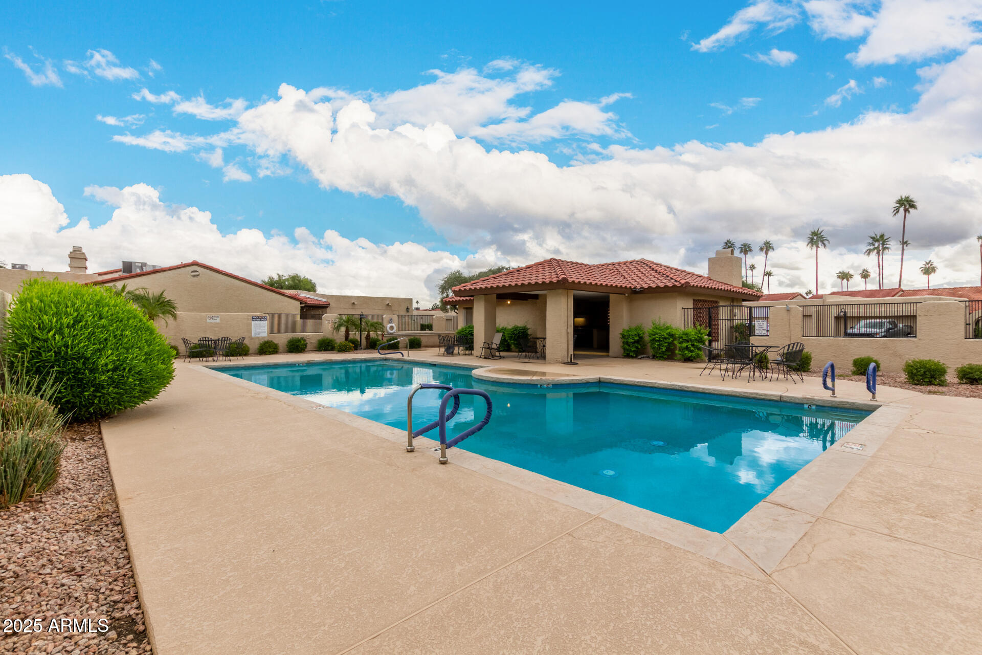 2059 East Brown Road, Unit 30 Mesa, AZ 85213 - Photo 21 of 24 a view of a patio with swimming pool