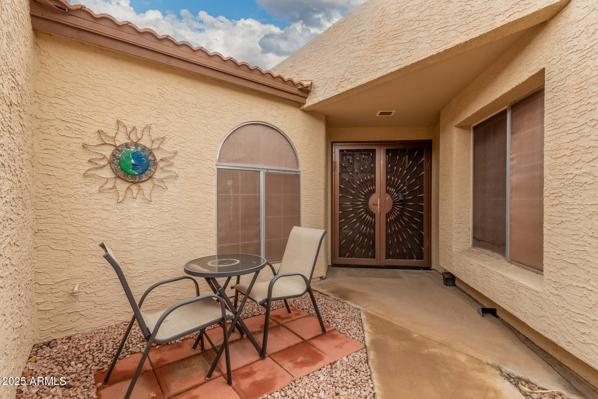 2059 East Brown Road, Unit 30 Mesa, AZ 85213 - Photo 3 of 24 a view of patio with table and chairs and potted plants