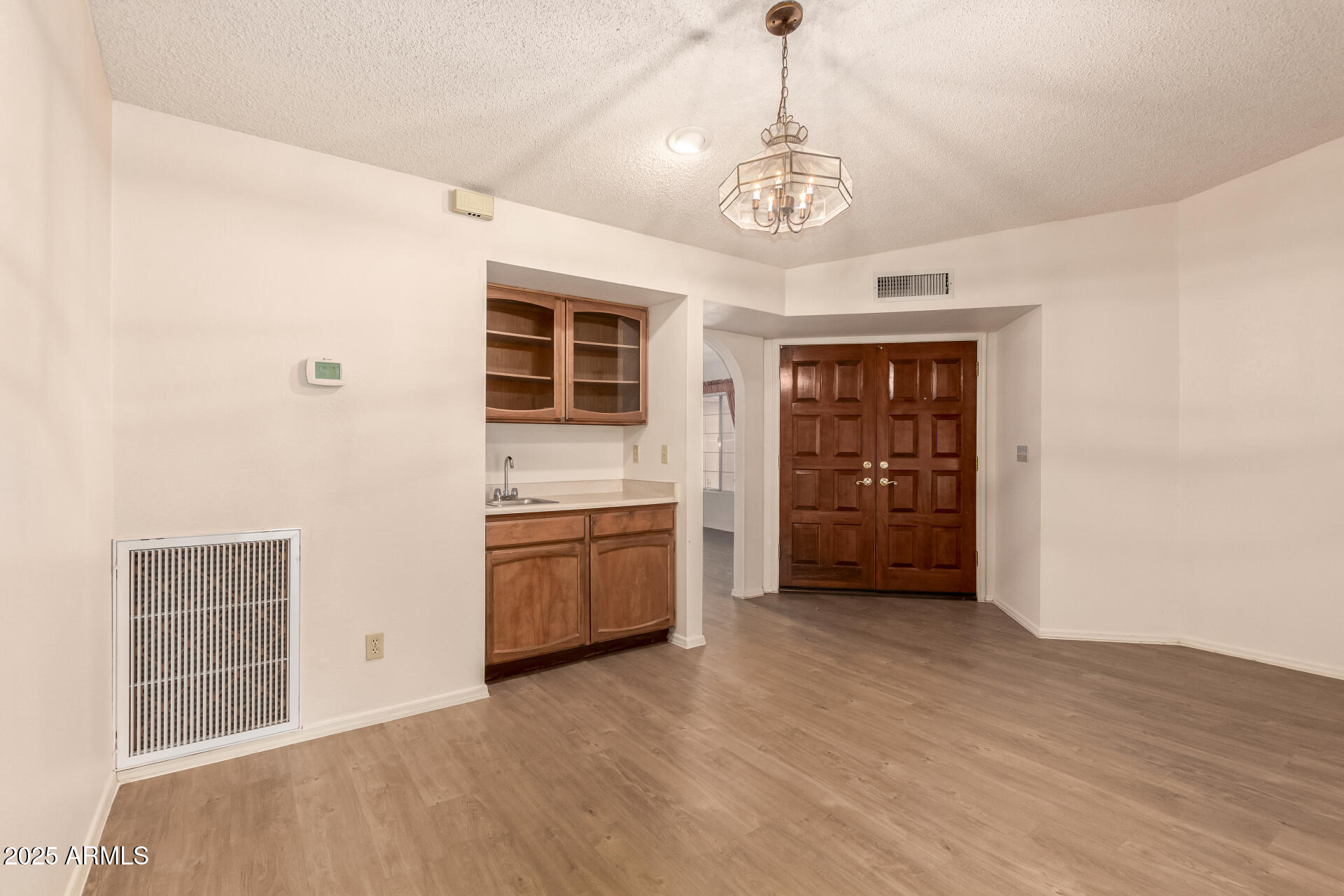 2059 East Brown Road, Unit 30 Mesa, AZ 85213 - Photo 7 of 24 a view of a kitchen with a sink and dishwasher