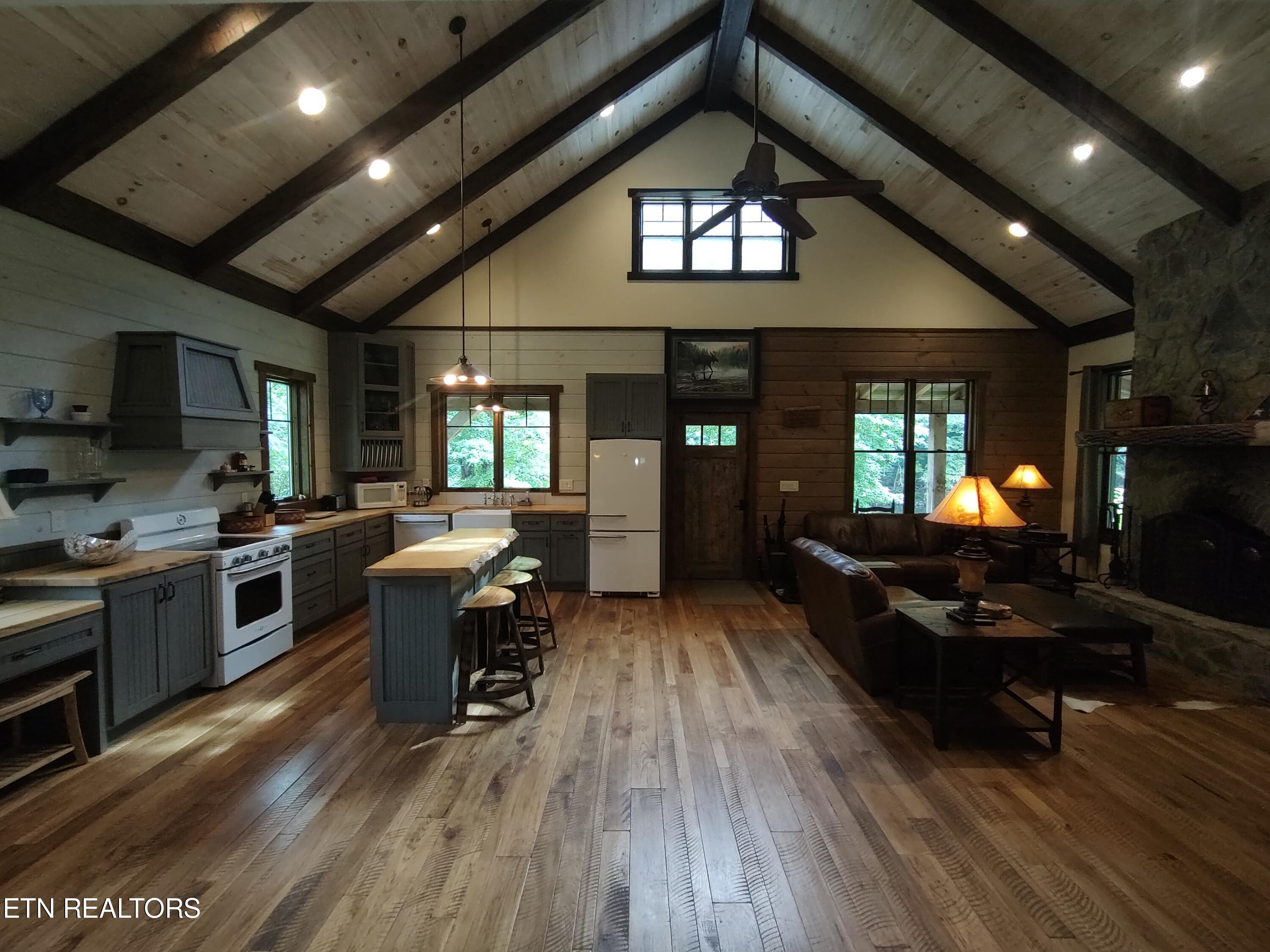 216 Rafter Road Tellico Plains, TN 37385 - Photo 29 of 47 kitchen and living room