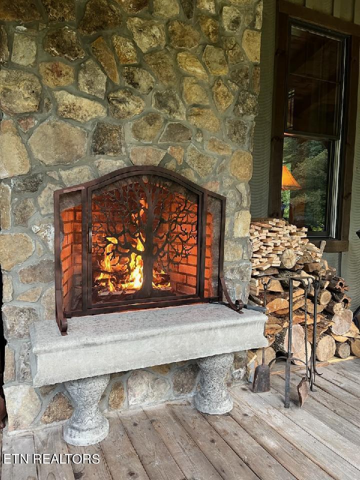 216 Rafter Road Tellico Plains, TN 37385 - Photo 10 of 47 Outside fireplace