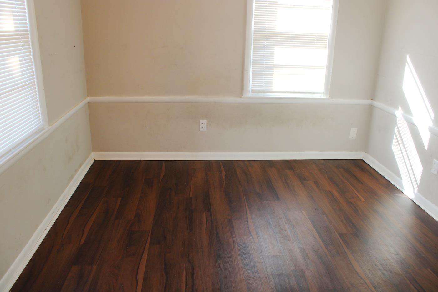 1673 South White Station Road Memphis, TN 38117 - Photo 17 of 17 Spare room featuring dark wood-style floors and plenty of natural light