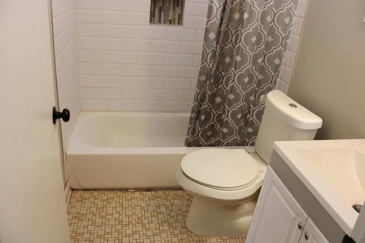 1673 South White Station Road Memphis, TN 38117 - Photo 5 of 17 Full bath featuring vanity and shower / bath combination with curtain