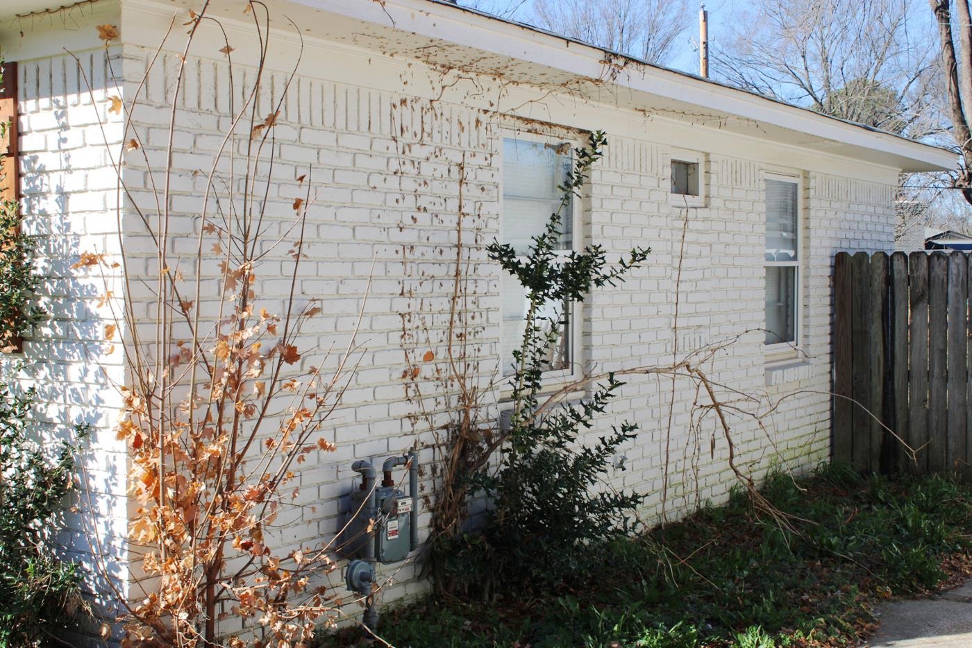 1673 South White Station Road Memphis, TN 38117 - Photo 9 of 17 View of home's exterior featuring brick siding