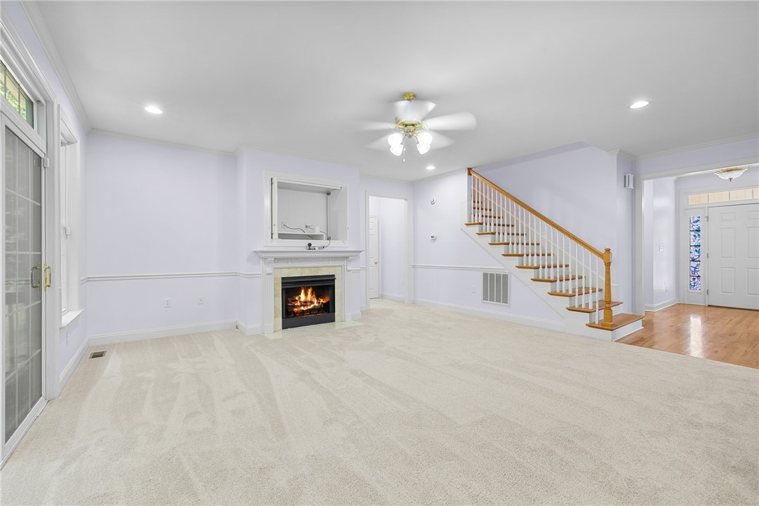 110 Brookstone Way Central, SC 29630 - Photo 13 of 46 This bright living space features a cozy fireplace and convenient access to the upstairs.