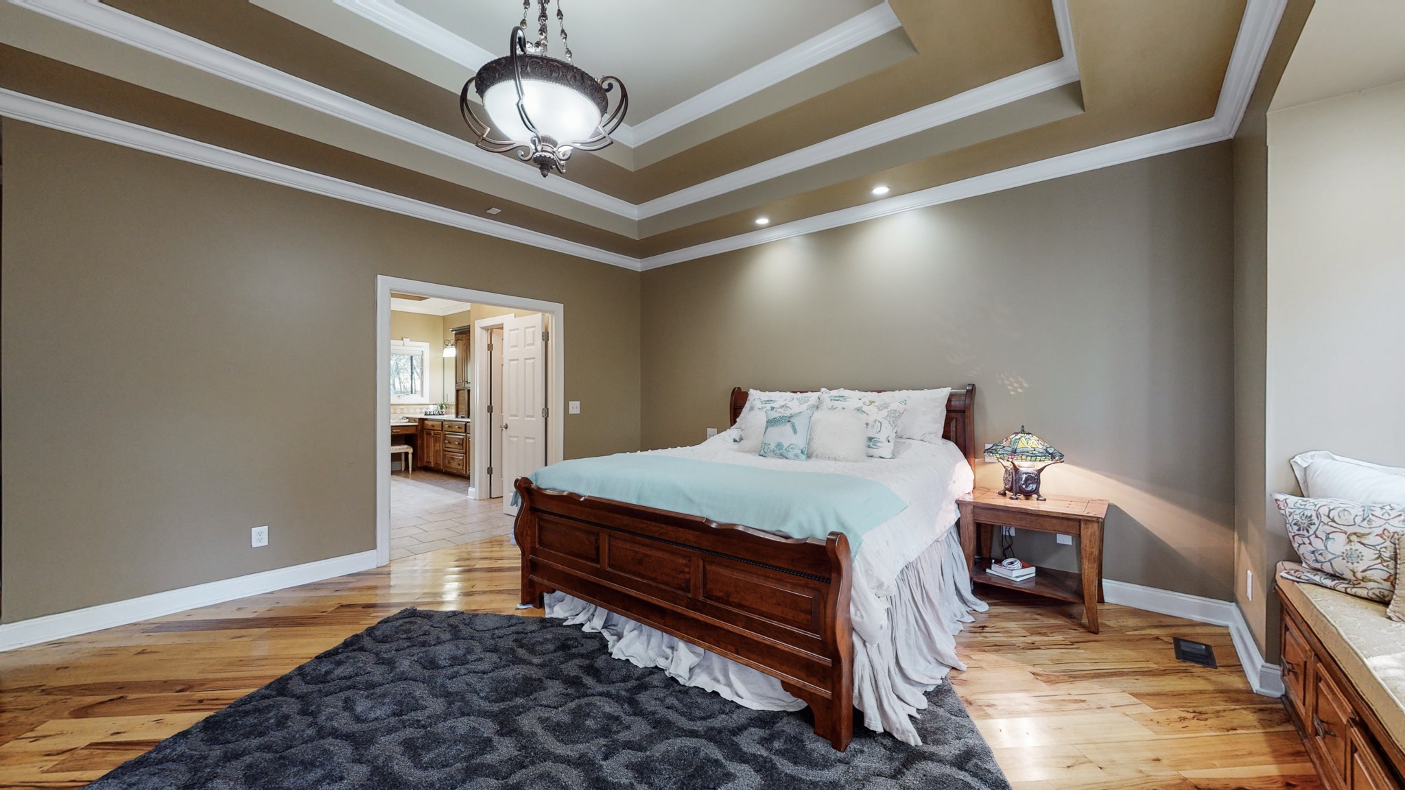 841 Vanderbilt Road Mount Juliet, TN 37122 - Photo 28 of 50 a bedroom with a bed and a chandelier