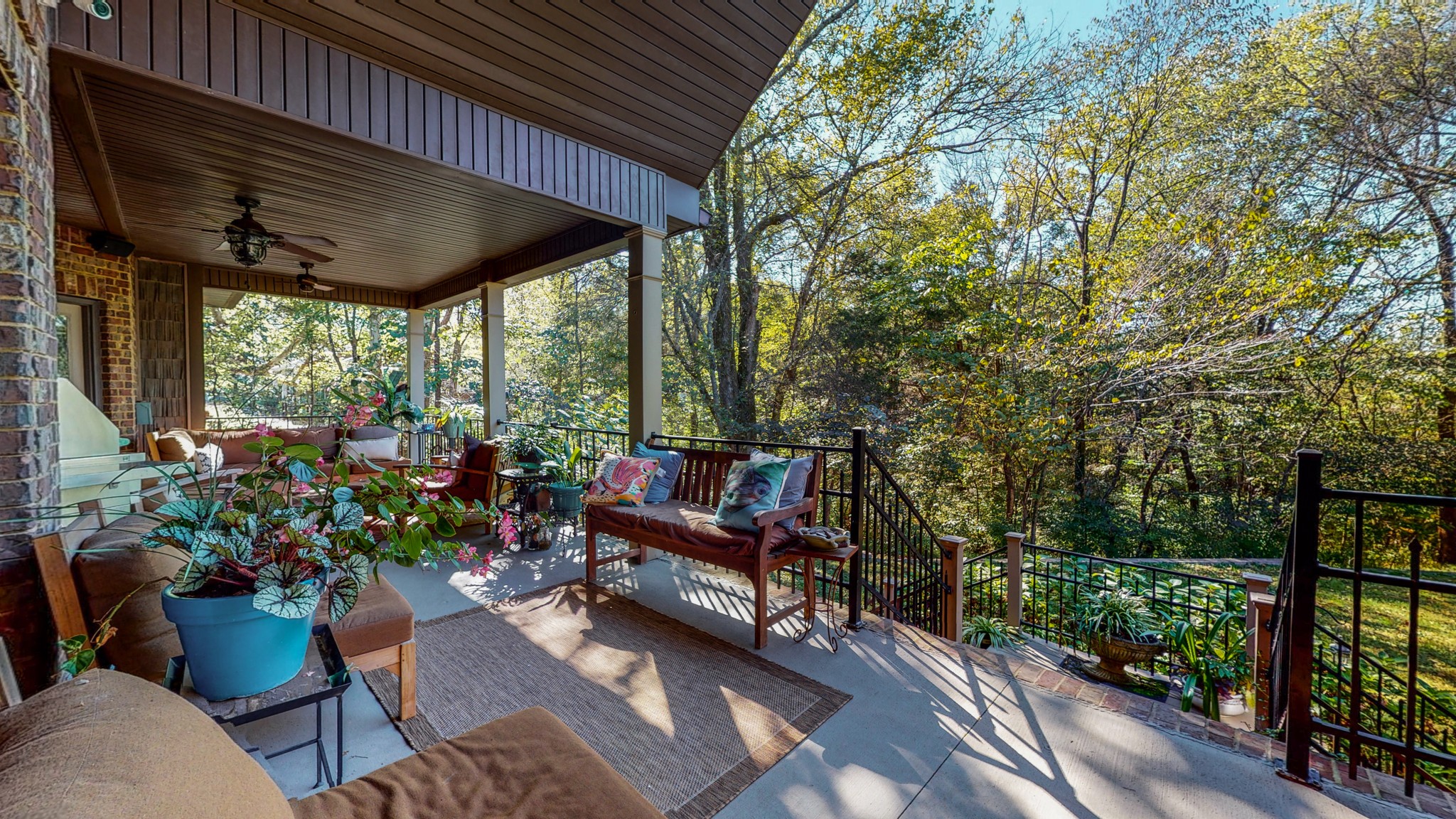841 Vanderbilt Road Mount Juliet, TN 37122 - Photo 40 of 50 a view of a patio with couches table and chairs and potted plants