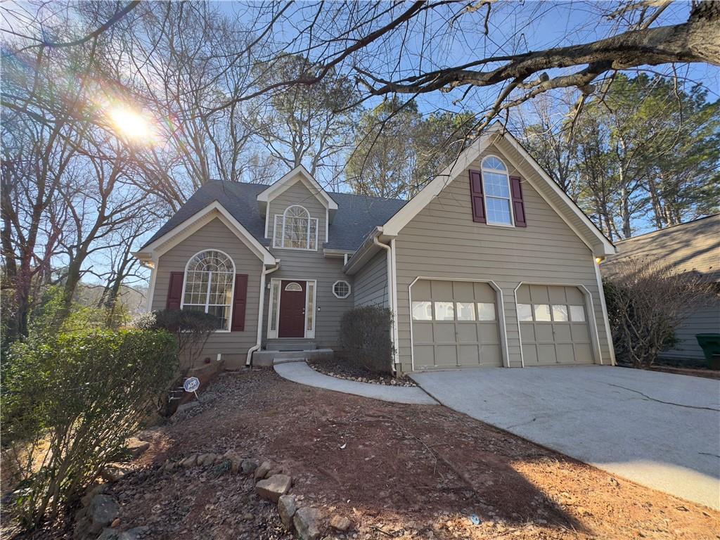 2887 Royal Bluff Decatur, GA 30030 - Photo 1 of 1 a front view of a house with a yard and garage