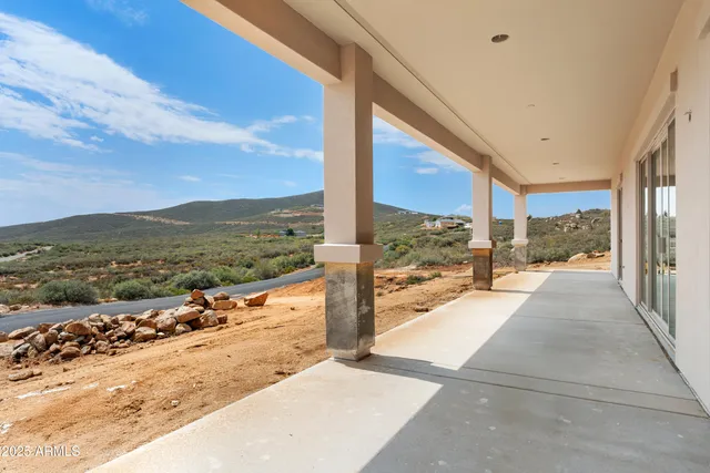 a kitchen that has a lot of cabinets in it and appliances