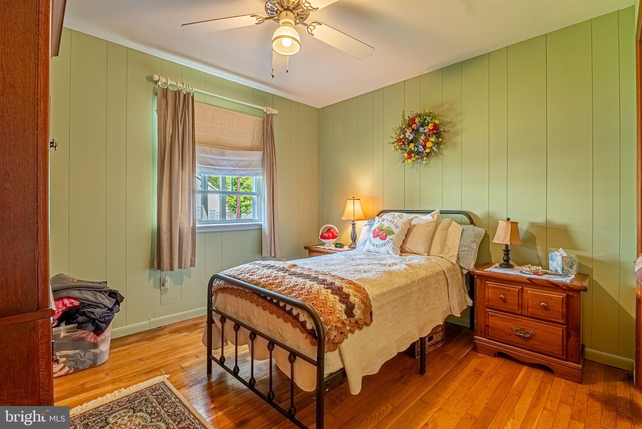 14100 Brant Road Southwest Cumberland, MD 21502 - Photo 15 of 40 a bedroom with a bed and a chandelier