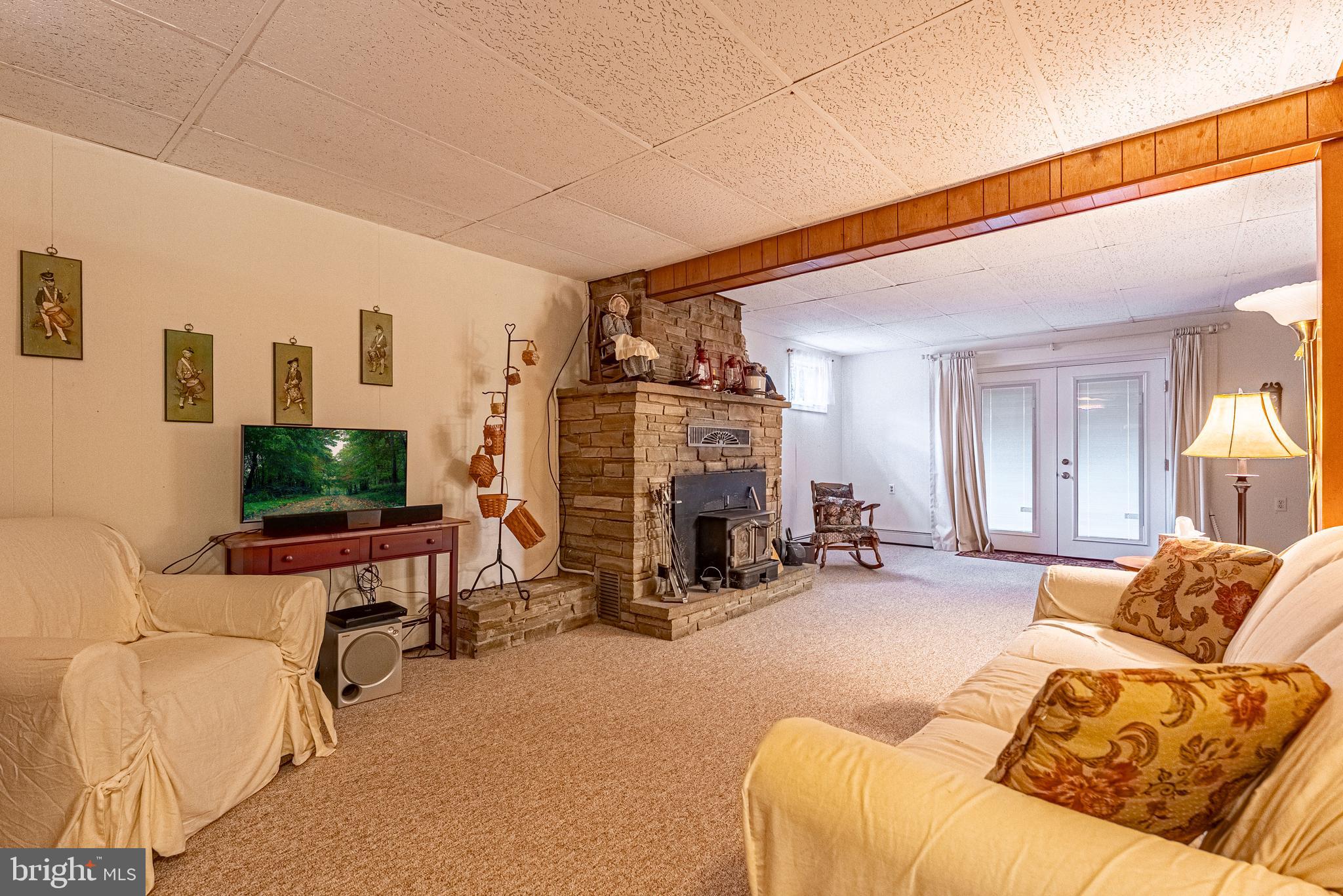 14100 Brant Road Southwest Cumberland, MD 21502 - Photo 22 of 40 a living room with furniture and a flat screen tv