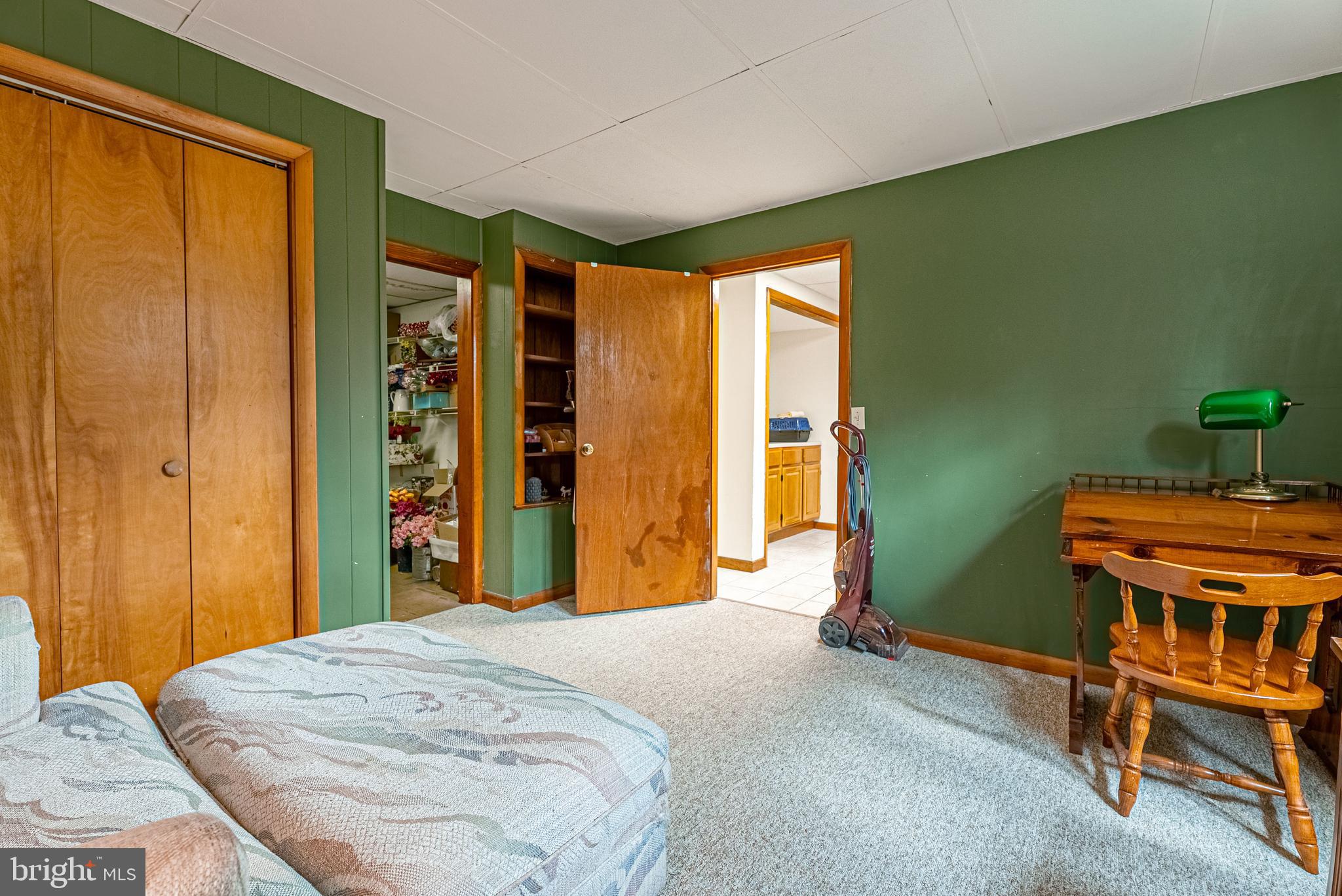14100 Brant Road Southwest Cumberland, MD 21502 - Photo 29 of 40 a bedroom with a bed and a dresser