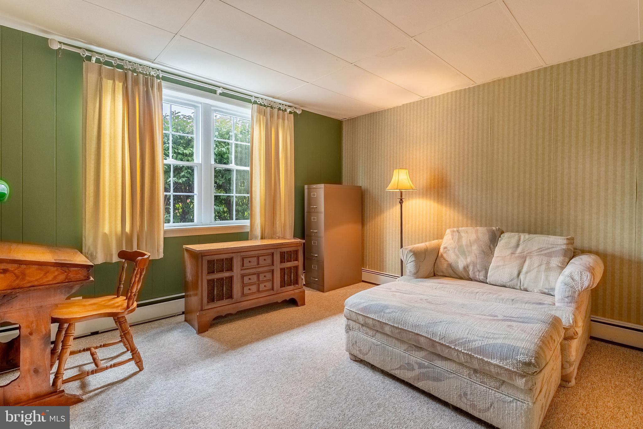14100 Brant Road Southwest Cumberland, MD 21502 - Photo 30 of 40 a bedroom with a bed and a dresser next to a window
