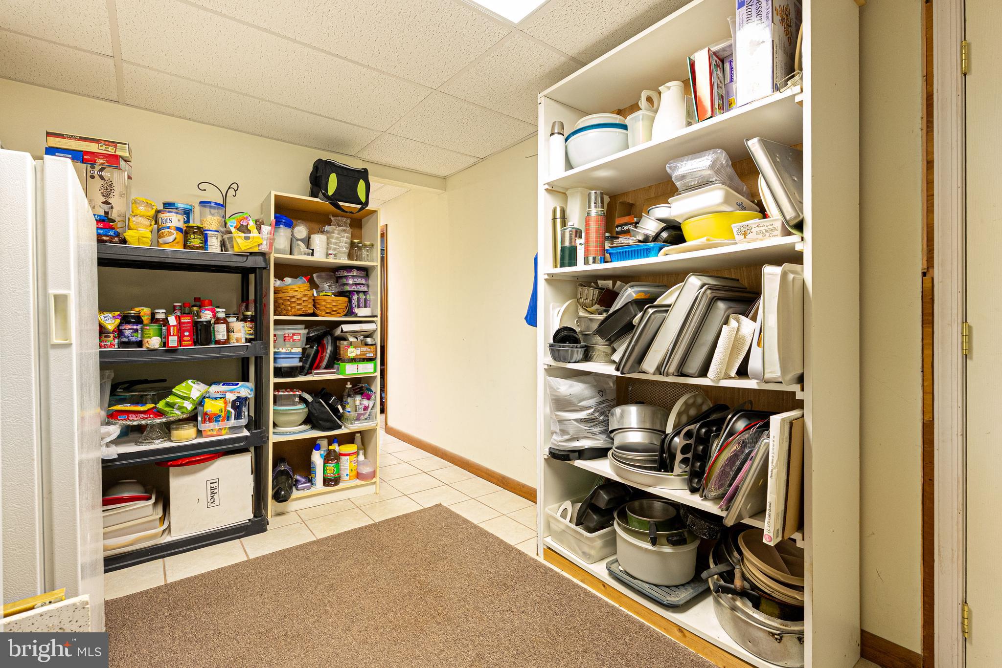 14100 Brant Road Southwest Cumberland, MD 21502 - Photo 32 of 40 a view of walk in closet with clothes and shoes