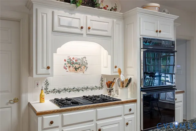a kitchen with a stove and cabinets