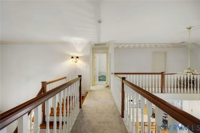a view of hallway with wooden floor