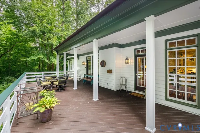 a front view of a house with outdoor seating
