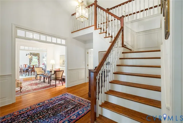 a view of entryway dining room and hall with wooden floor