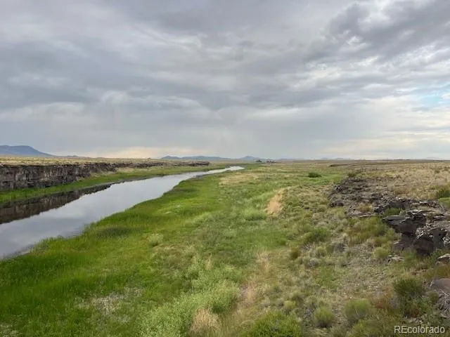 a view of an ocean and mountain