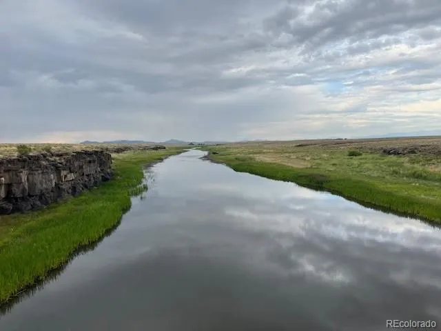 a view of a lake with a big yard