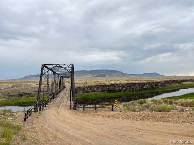 a view of a lake with a mountain from a terrace