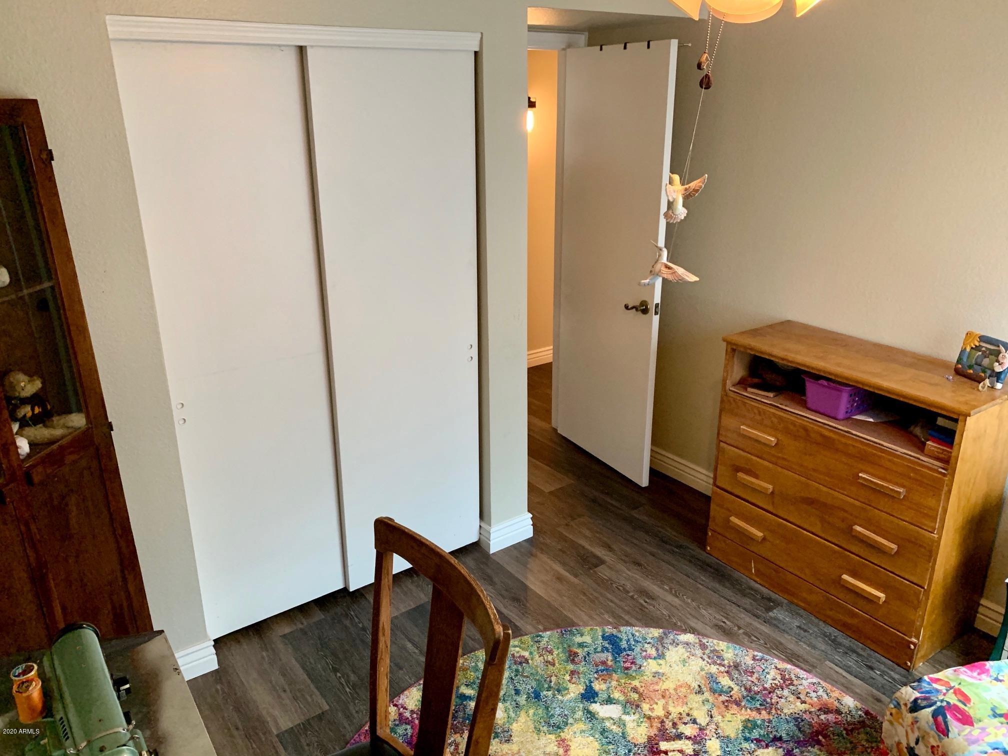 500 South Terrace Road Chandler, AZ 85226 - Photo 15 of 22 a view of a hallway with wooden floor and closet