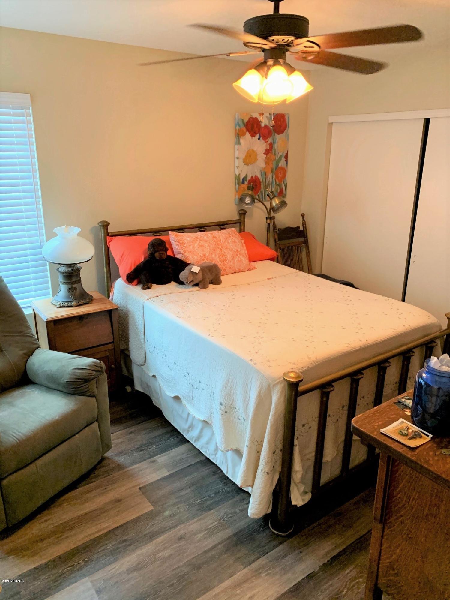 500 South Terrace Road Chandler, AZ 85226 - Photo 17 of 22 a bedroom with a bed and wooden floor
