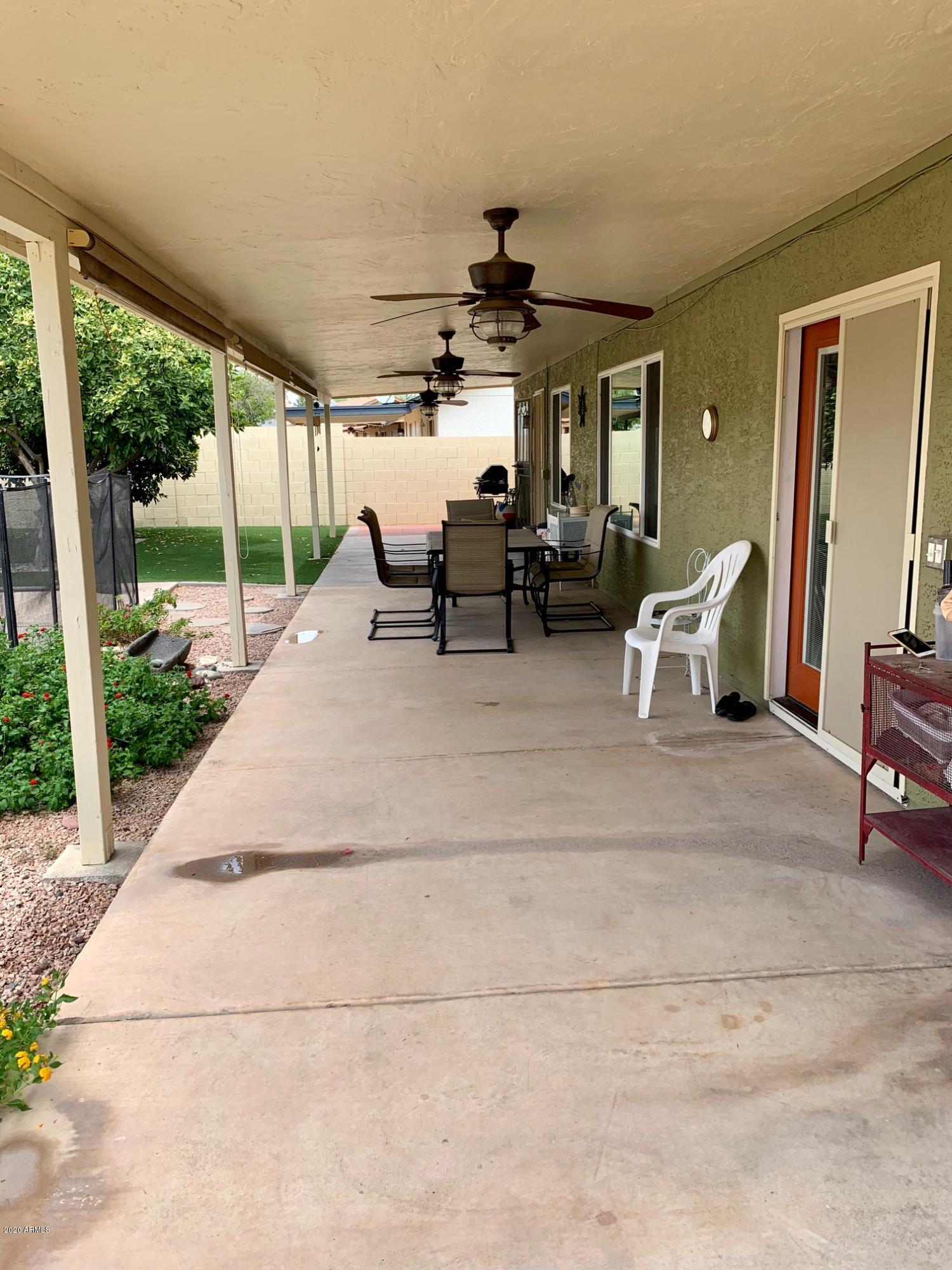 500 South Terrace Road Chandler, AZ 85226 - Photo 21 of 22 a view of a patio with table and chairs next to a yard