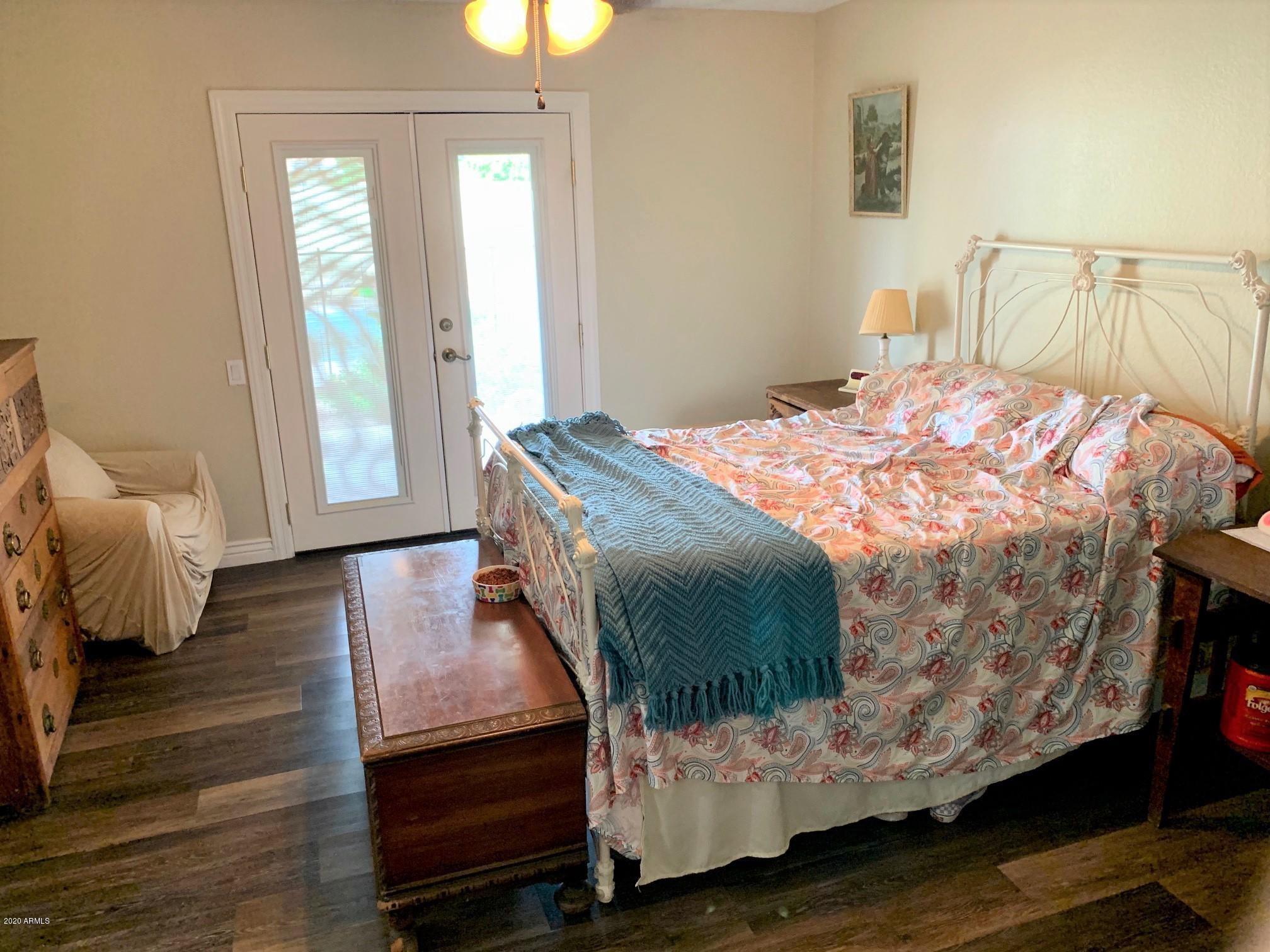 500 South Terrace Road Chandler, AZ 85226 - Photo 10 of 22 a bedroom with a bed and wooden floor