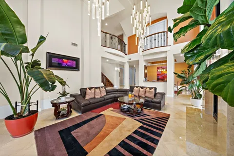 a kitchen with a dining table cabinets appliances and a window