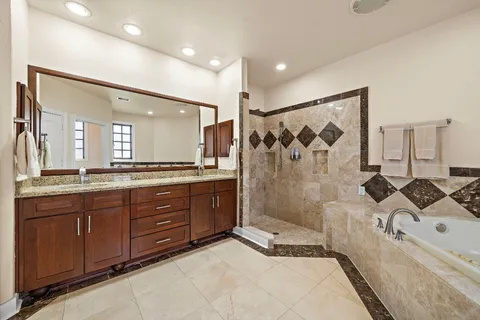 a bathroom with a bathtub and shower