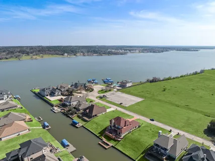 an aerial view of a house with a ocean view