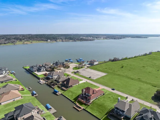 an aerial view of a house with a ocean view