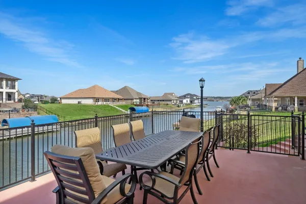 a view of a patio with a table and chairs