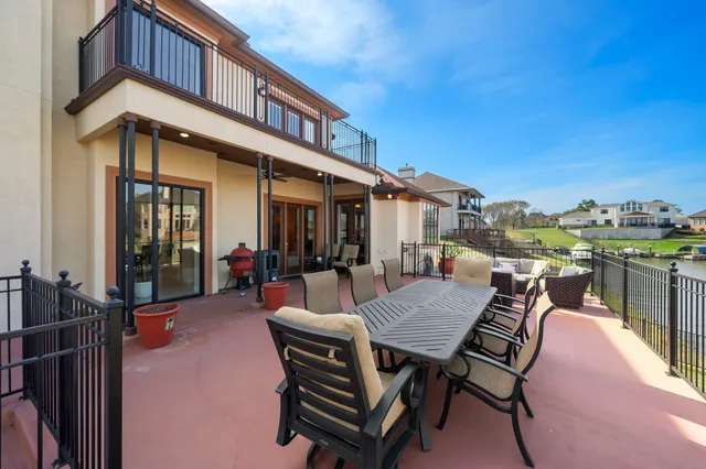 a view of a patio with a table and chairs