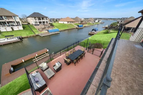 a view of a lake with couches and city view