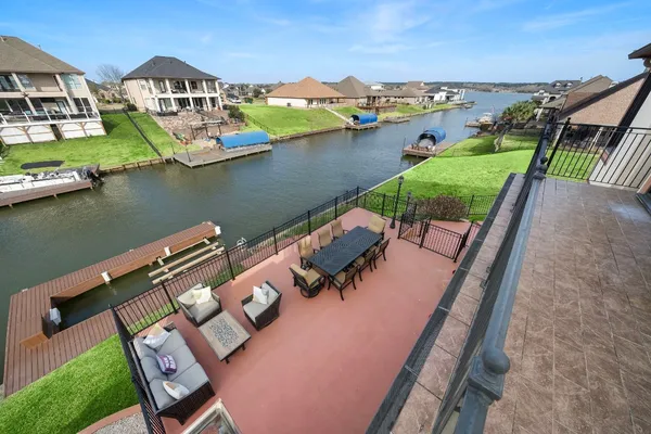 a view of a lake with couches and city view