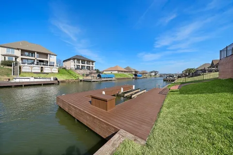 an aerial view of a house with a big yard