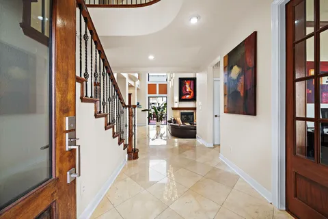 a view of a hallway with furniture and entryway