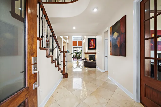 a view of a hallway with furniture and entryway