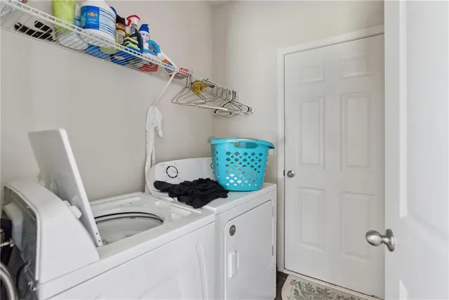 a utility room with dryer and washer