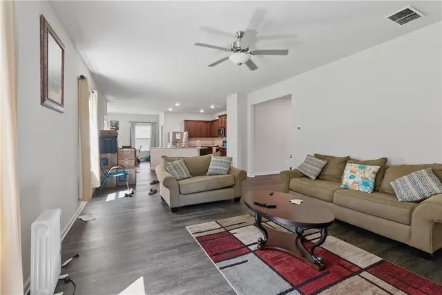 a living room with furniture and a rug