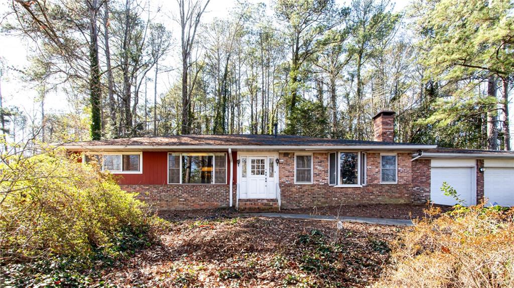 1460 Loch Lomond Trail Southwest Atlanta, GA 30331 - Photo 1 of 1 front view of a house with a yard