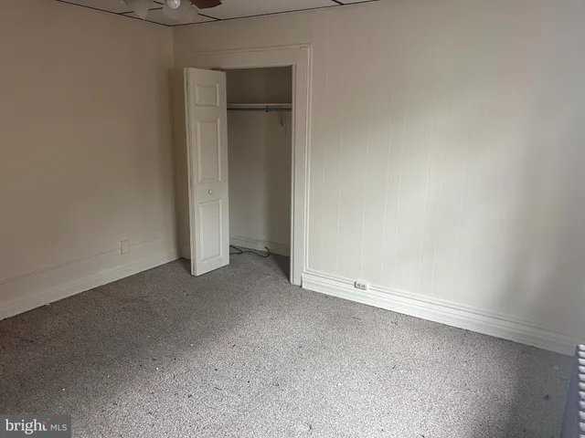 an empty room with an empty space and a window