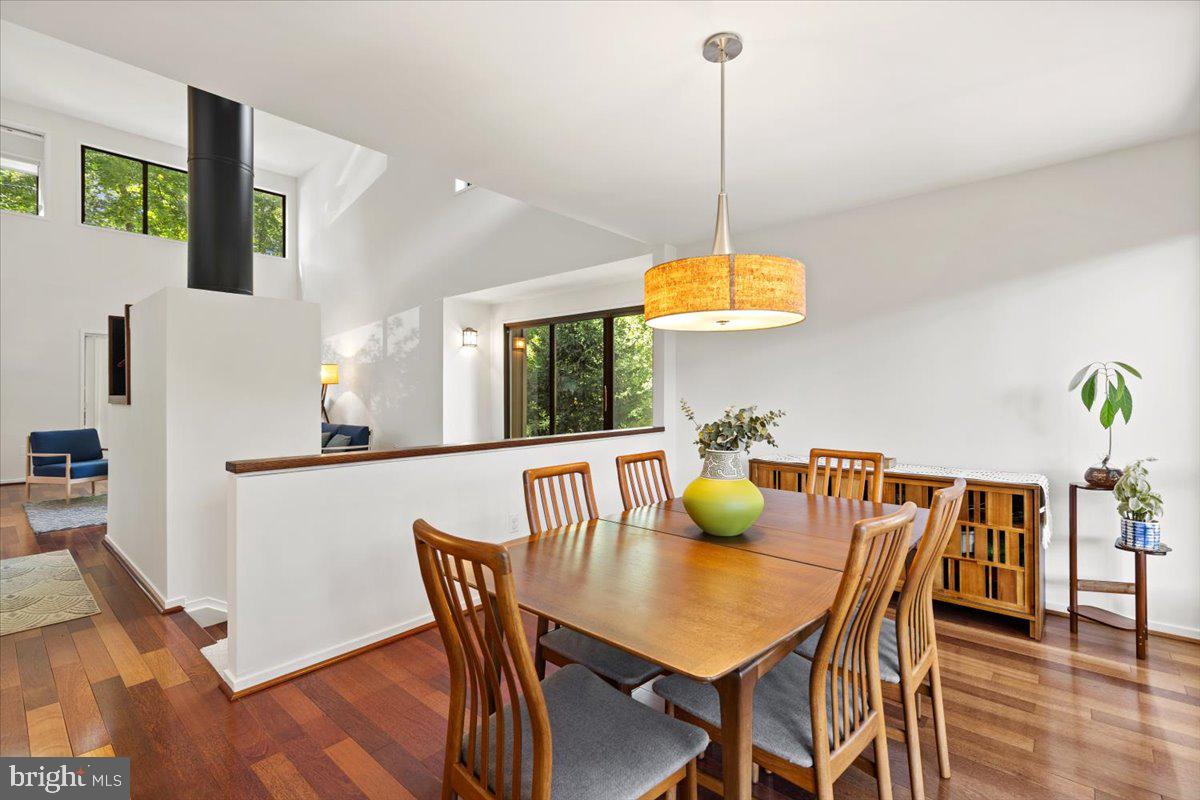 9411 Fernwood Road Bethesda, MD 20817 - Photo 12 of 101 a view of a dining room with furniture and wooden floor