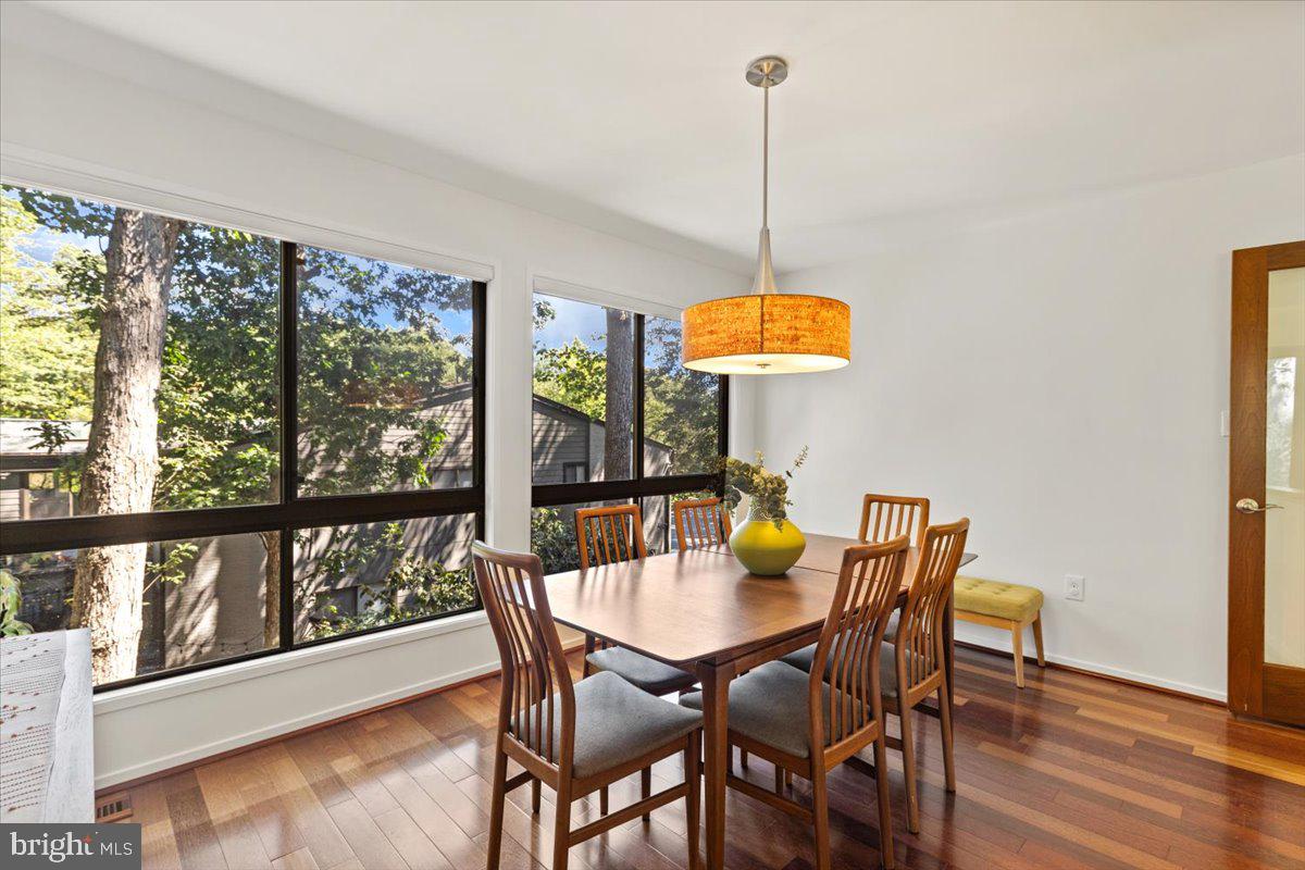 9411 Fernwood Road Bethesda, MD 20817 - Photo 15 of 101 a view of a dining room with furniture window and wooden floor