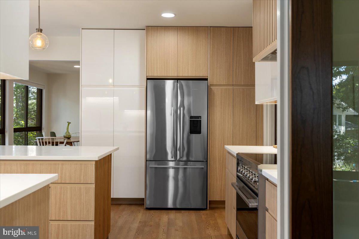 9411 Fernwood Road Bethesda, MD 20817 - Photo 22 of 101 a kitchen with a refrigerator sink and stove