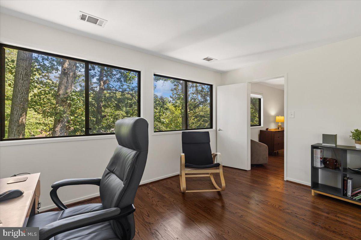 9411 Fernwood Road Bethesda, MD 20817 - Photo 40 of 101 a view of a workspace with furniture and a window