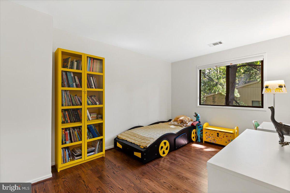 9411 Fernwood Road Bethesda, MD 20817 - Photo 44 of 101 a room with a bed and a window