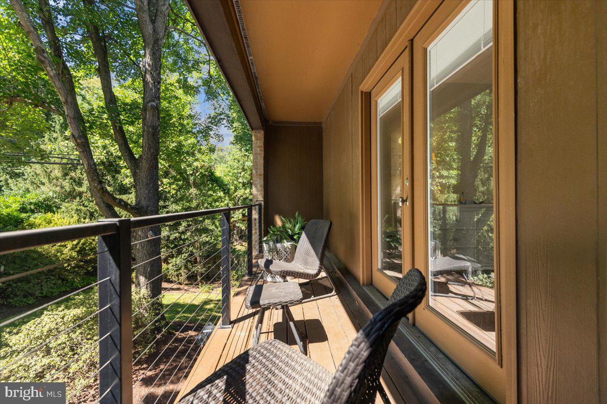 9411 Fernwood Road Bethesda, MD 20817 - Photo 50 of 101 a view of balcony with wooden floor and outdoor seating